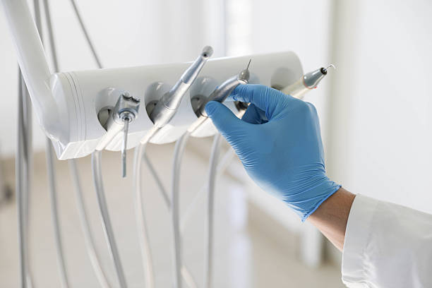 Professional Tooth Extraction technician working in Island Walk, FL